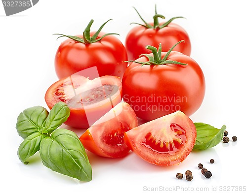 Image of tomatoes, basil leaves and black pepper