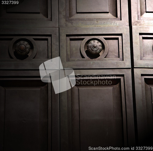 Image of in london antique brown door  rusty  brass nail and light