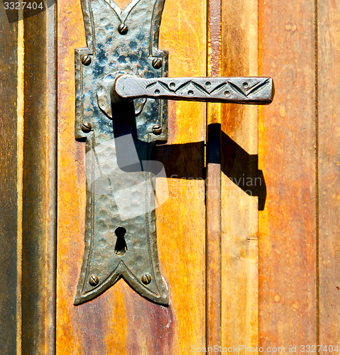 Image of castellanza blur  brown knocker in a  door c  wood italy   cross