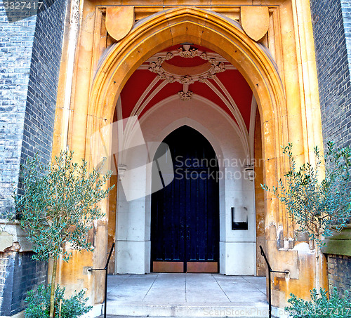 Image of brown wooden parliament in london old  door and marble antique  