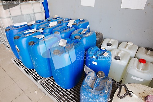 Image of Plastic cans of chemicals