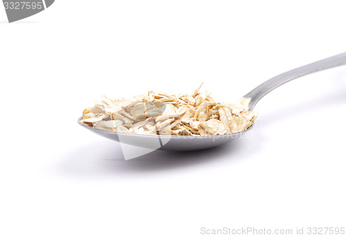 Image of Oat flakes on spoon