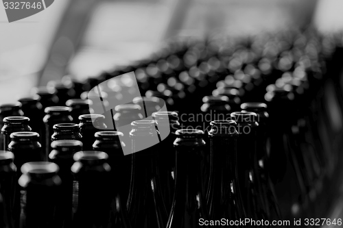 Image of Many bottles on conveyor belt