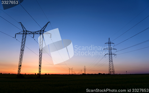 Image of Large transmission towers at blue hour 