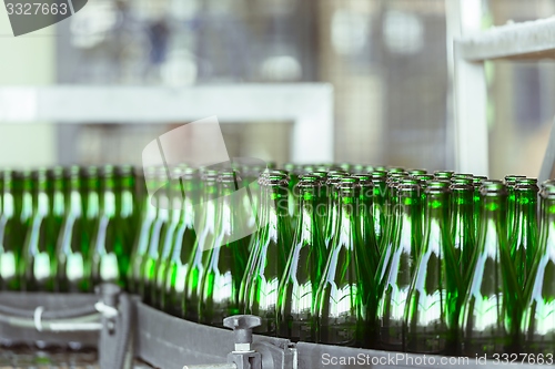 Image of Many bottles on conveyor belt