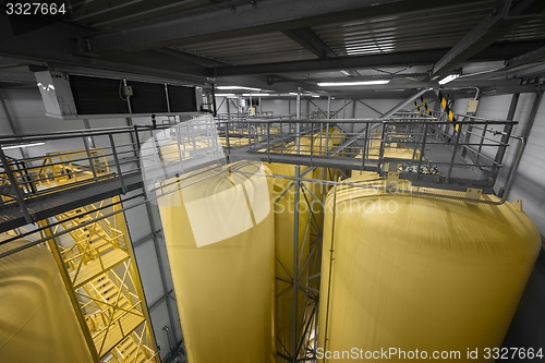 Image of Industrial interior with welded silos