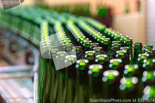 Image of Many bottles on conveyor belt