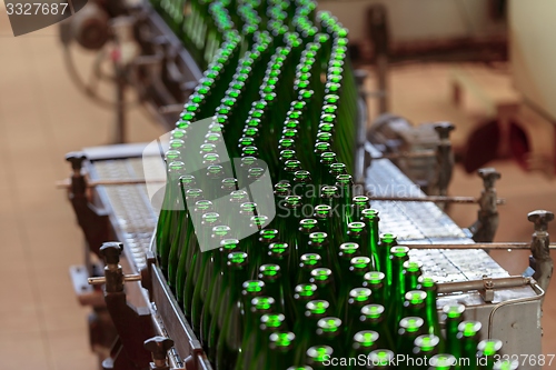 Image of Many bottles on conveyor belt