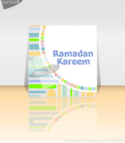 Image of Arabic Islamic calligraphy of text Ramadan Kareem on abstract background