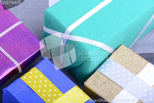 Image of bright gifts with ribbons, holiday invitation card