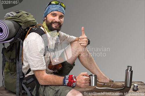 Image of Portrait of a smiling male fully equipped tourist 