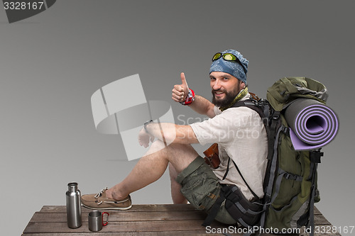 Image of Portrait of a smiling male fully equipped tourist 