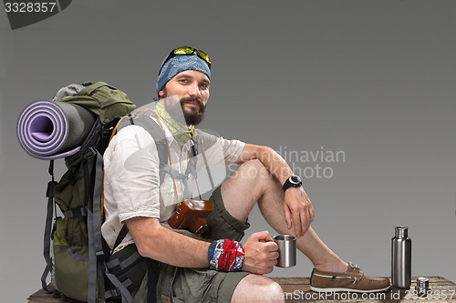 Image of Portrait of a smiling male fully equipped tourist 