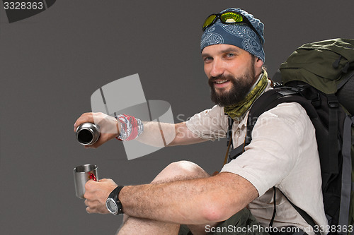 Image of Portrait of a smiling male fully equipped tourist 