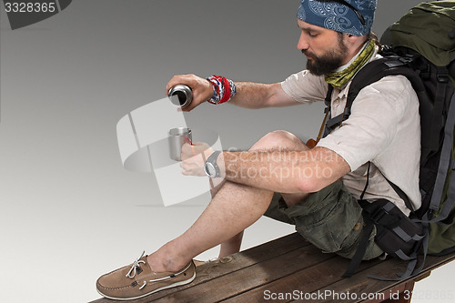 Image of Portrait of a smiling male fully equipped tourist 