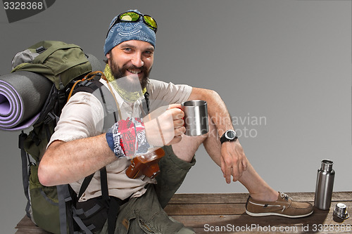 Image of Portrait of a smiling male fully equipped tourist 