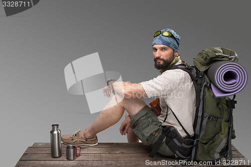 Image of Portrait of a smiling male fully equipped tourist 