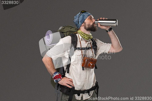 Image of Portrait of a smiling male fully equipped tourist 