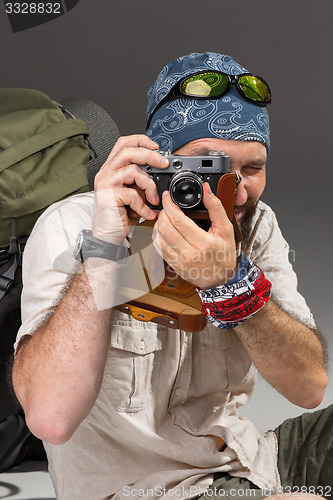 Image of tourist with camera