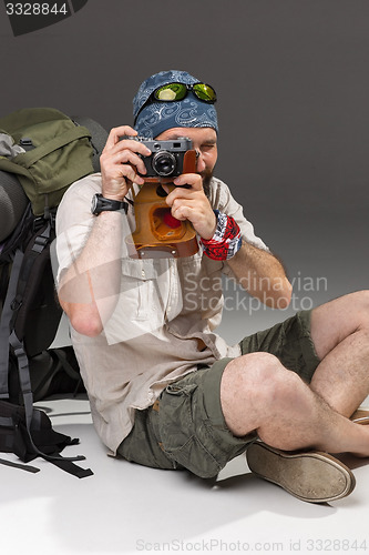 Image of tourist with camera