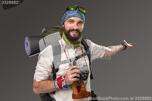 Image of Portrait of a smiling male fully equipped tourist 