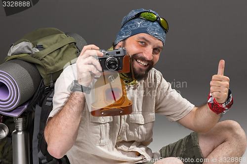 Image of tourist with camera