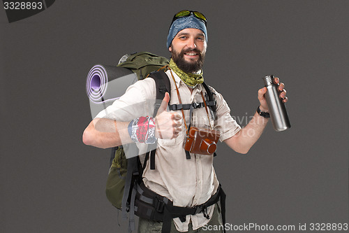 Image of Portrait of a smiling male fully equipped tourist 