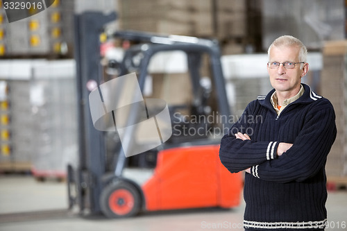 Image of Confident Supervisor Standing At Warehouse