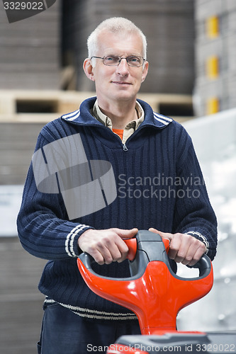 Image of Confident Worker Standing At Warehouse