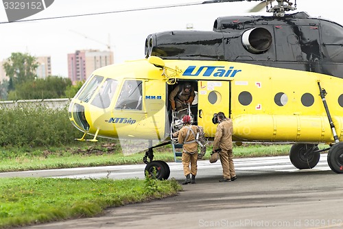 Image of Rescuers load into helicopter MI-8 