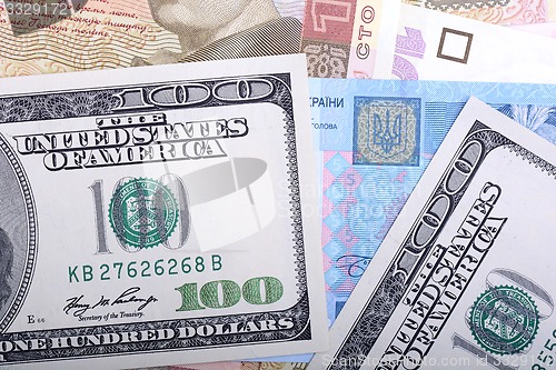 Image of Ukrainian hryvnia and the american dollars