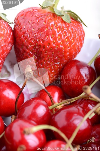 Image of Sweet cherries and strawberries close up
