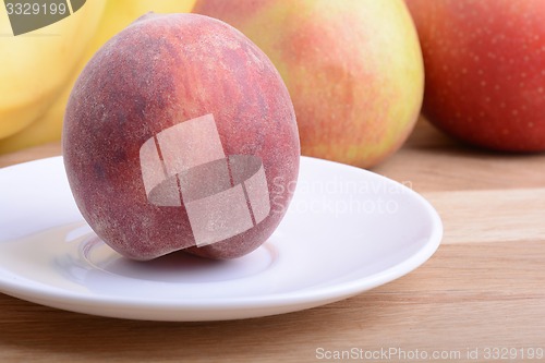 Image of fruits on wodden table, peach, apple, food concept