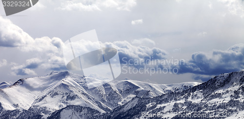 Image of Panoramic view on mountains in evening and cloudy sky