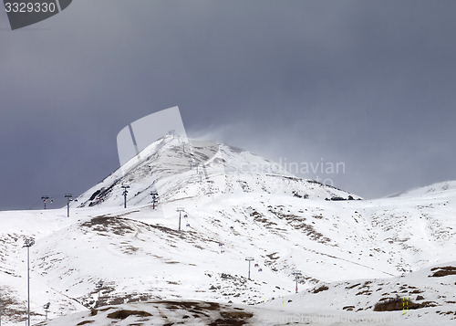 Image of Ski slopes in little snow year at bad weather day