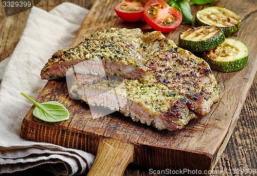 Image of grilled meat on cutting board