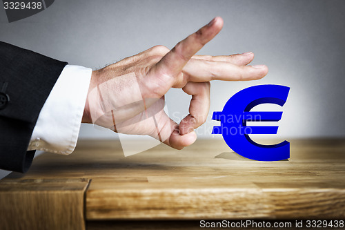 Image of Man shoots Euro sign off