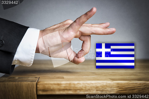 Image of Man shoots Greek Flag off