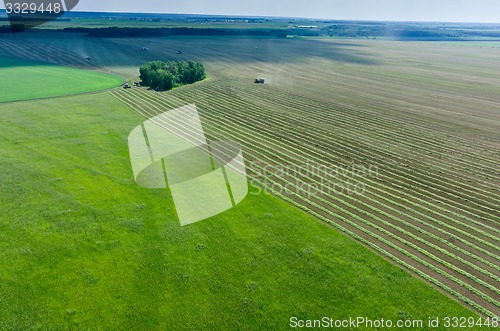 Image of Agricultural field with harvester