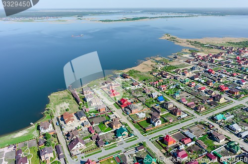 Image of Private houses on bank of lake