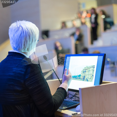 Image of Business woman lecturing at Conference.