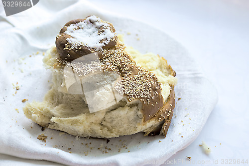 Image of Snapped loaf of traditional bread and salt