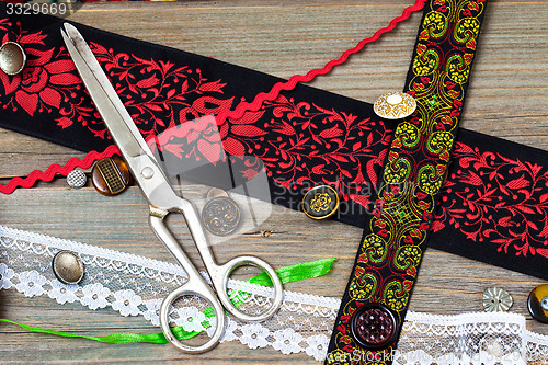 Image of vintage scissors, ribbons and old buttons