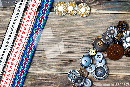 Image of three vintage ribbons, tape and buttons