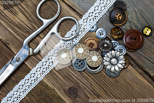 Image of vintage buttons, lace, and a dressmaker scissors