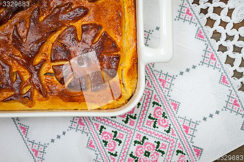 Image of Kulebyaka. cabbage pie on the embroidered cloth