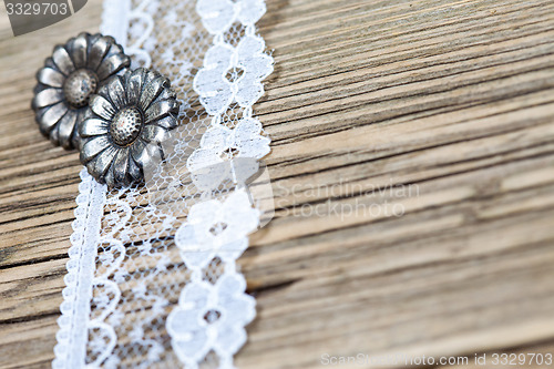 Image of vintage button and lace tape