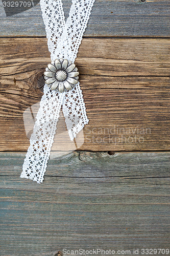 Image of buttons flowers and lace tape