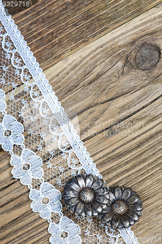 Image of vintage button and lace tape