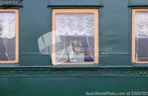 Image of windows of vintage railroad wagon-lit